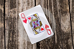 Queen of Hearts Card on Wood