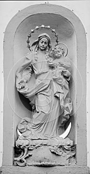 Queen of Heaven. Ancient statue of the Virgin Mary with Jesus Christ. Religion, faith, God concept