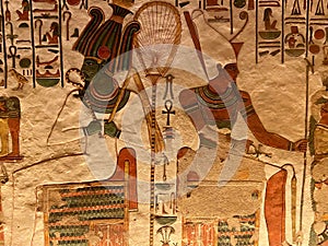 Queen Nefertari tomb in Queens valley in Luxor - Osiris and Atum receiving offerings from Nefertari