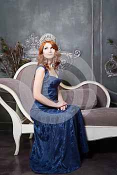 Queen, royal person with crown, red hair in blue violet dress