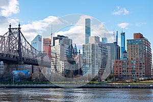 Queensboro Bridge along the East River with the Midtown Manhattan and Roosevelt Island Skyline in New York City