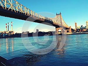 Queensboro bridge over newyork city east river at sunset . photo