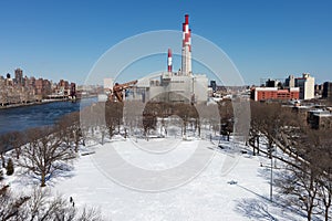 Queensbridge Park in Long Island City Queens Covered in Snow during Winter with a Power Plant