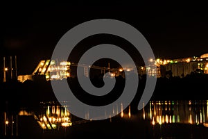 Queensland Alumina refinery in Gladstone at night.