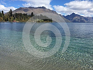 Queenstown Waterfront turquoise crystal clear water on sunny day