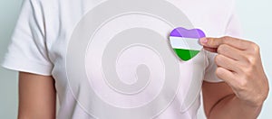 Queer Pride Day and LGBT pride month concept. purple, white and green heart shape for Lesbian, Gay, Bisexual, Transgender,