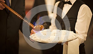 Queimada burning hot alcohol drink waiter in wedding photo