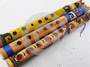 Quena flutes. Colorful traditional Andrean wind instruments.