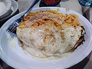 Queso smothered quesadilla And Spanish rice