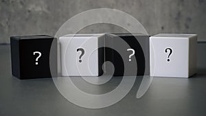 Question and answer concept. Stack of black and white cube with a symbol of question mark