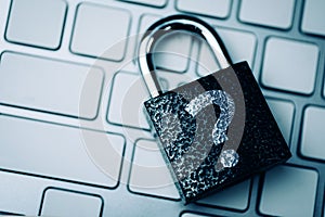 Question mark concept or FAQ. The sign on the padlock on the keyboard, as a symbol of security