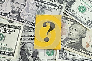 Question mark on dollar banknotes