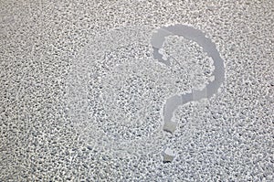 Question mark. The inscription on a wet metal surface