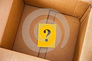 Question mark inside cardboard box