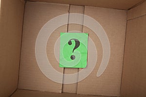 Question mark inside of a cardboard box