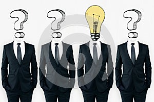 Question mark and lightbulb headed businessmen