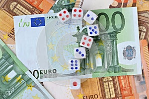 Question mark made of dices on euro money background - Concept of risky investments and gamble