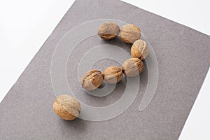 a question mark made of walnuts. The concept of frequently asked questions