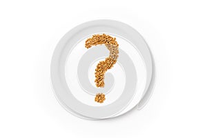 Question mark made of wheat grains on white plate. Concept of global food scarcity, famine and hunger. Food shortage and