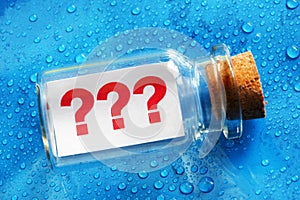 Question mark message in a bottle