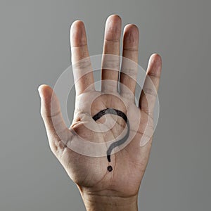 Question mark in the palm of a man