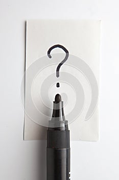 Question mark and a pen