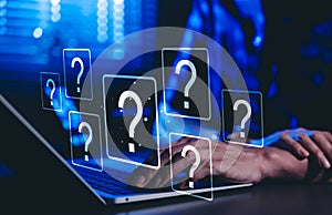 Question Mark and Problem Solving Concept. A person using a laptop with floating question marks, symbolizing brainstorming,