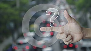 Question mark sign flat icon on finger over blur of rush hour with cars and road in city, Business customer service and support co