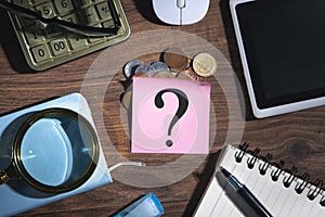 Question mark on sticky note with a business objects