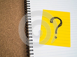 Question mark symbol on sticky note paper