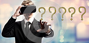 Question Mark text with businessman using a virtual reality