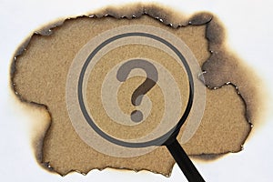 Question mark under a magnifier