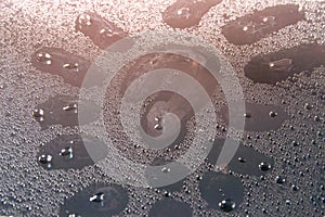question mark on the wet glass water Droplets glistening in the rays of light closeup, texture