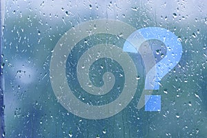 Question mark on a window