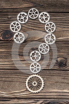 Question mark from wooden gears