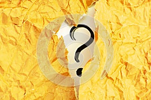 a question mark and yellow crumpled paper . FAQ frequency asked questions, Answer and Brainstorming Concepts