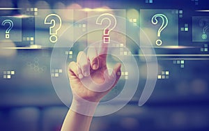 Question marks with hand pressing a button