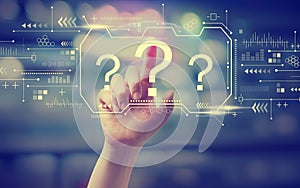 Question marks with hand pressing a button