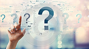 Question marks with hand pressing a button
