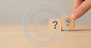 Question marks and light bulb symbolizing idea or solution. Problem solving skill, creativity, innovation.