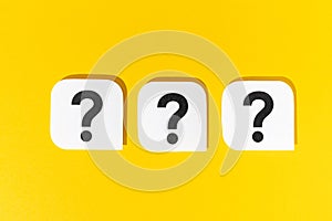 Question marks signs on yellow background