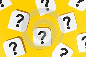 Question marks signs on yellow background