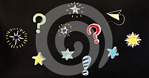 Question marks and stars drawing on blackboard