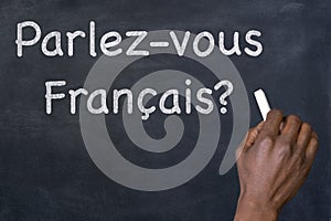 Question `Parlez-vous Francais?` on a blackboard