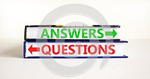 Questions and answers symbol. Concept word Questions Answers on beautiful books. Beautiful white table white background. Business