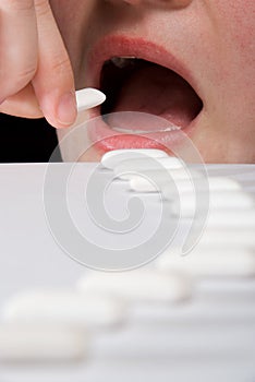 Queue of chewing gums heading to open mouth