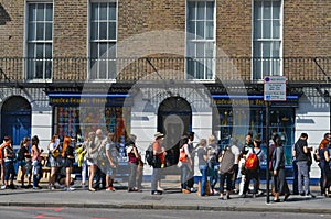 Queue on the sidewalk in front of the beatles store in bakerstreet