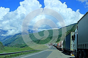 Queue of trucks waiting in line for border customs control, Georgian Military Road.