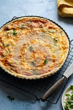 Quiche with ham and cheese. Open pie.