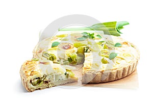 Quiche with leek and cheese isolated on white